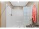 Modern bathroom featuring a walk-in shower with a blue patterned curtain at 2706 Willow St., North Myrtle Beach, SC 29582