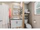 Well-organized bathroom with white vanity, dark countertop, and ample storage at 2706 Willow St., North Myrtle Beach, SC 29582