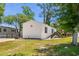 Charming white mobile home featuring a well-maintained lawn and inviting wood porch with stairs at 2706 Willow St., North Myrtle Beach, SC 29582