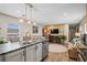 Kitchen view showcasing the island, stainless steel appliances, and seamless transition to the living area, ideal for entertaining at 2706 Willow St., North Myrtle Beach, SC 29582