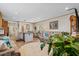 Comfortable living room with plush seating, a round rug, and an island kitchen with sleek white cabinets and modern lighting at 2706 Willow St., North Myrtle Beach, SC 29582