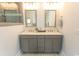 Bathroom features dual sinks, a vanity, and well lit mirrors for a comfortable experience at 2928 Moss Bridge Ln., Myrtle Beach, SC 29579