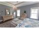 This bedroom features a tray ceiling, beautiful wood floors and coastal themed decor at 2928 Moss Bridge Ln., Myrtle Beach, SC 29579