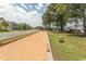 Community bocce court with manicured grass and a comfortable seating area, perfect for outdoor recreation and socializing at 2928 Moss Bridge Ln., Myrtle Beach, SC 29579