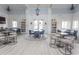 Elegant clubhouse featuring multiple tables and chairs, bookshelves, and stylish decor for social gatherings at 2928 Moss Bridge Ln., Myrtle Beach, SC 29579