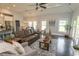 Open-concept living room with dark hardwood floors and neutral color palette at 2928 Moss Bridge Ln., Myrtle Beach, SC 29579