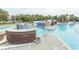 Stunning pool with unique features, including a blue tiled waterfall and an island connected by a charming bridge at 2928 Moss Bridge Ln., Myrtle Beach, SC 29579