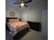 Comfortable bedroom with a decorative wall hanging, ceiling fan and plenty of storage at 307 Black Oak Ln. # 102, Murrells Inlet, SC 29576