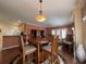 An open-concept dining area with view into living room and kitchen at 307 Black Oak Ln. # 102, Murrells Inlet, SC 29576