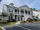Two-story condo building featuring stairs to the second floor, private balconies, and yard at 307 Black Oak Ln. # 102, Murrells Inlet, SC 29576