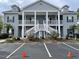Two-story condo building featuring stairs to the second floor and reserved parking at 307 Black Oak Ln. # 102, Murrells Inlet, SC 29576