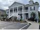 Two-story condo building featuring handicap parking, elevator, and private balconies at 307 Black Oak Ln. # 102, Murrells Inlet, SC 29576