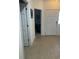 Inviting foyer with tile flooring, white doors, and view into an office space at 307 Black Oak Ln. # 102, Murrells Inlet, SC 29576