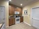 Kitchen features wood cabinetry, white appliances and plenty of storage at 307 Black Oak Ln. # 102, Murrells Inlet, SC 29576