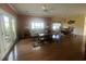 Bright and airy living room featuring hardwood floors, neutral decor, and a view into the dining area at 307 Black Oak Ln. # 102, Murrells Inlet, SC 29576