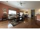 Spacious living room with hardwood flooring, neutral paint, ceiling fan, and large windows at 307 Black Oak Ln. # 102, Murrells Inlet, SC 29576