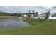 Scenic community pond with lush landscaping, perfect for outdoor enjoyment at 307 Black Oak Ln. # 102, Murrells Inlet, SC 29576
