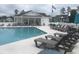Community pool with lounge chairs and clubhouse for relaxing days in the sun at 307 Black Oak Ln. # 102, Murrells Inlet, SC 29576