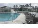 Community pool with lounge chairs, clubhouse, and manicured landscaping for relaxing days at 307 Black Oak Ln. # 102, Murrells Inlet, SC 29576