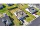 Aerial view of a home featuring well-manicured lawns, an attached garage, and a private driveway at 313 Palladium Dr., Surfside Beach, SC 29575
