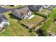 Aerial view of a spacious, fenced backyard with patio seating and a beautifully maintained lawn at 313 Palladium Dr., Surfside Beach, SC 29575