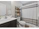 Bathroom featuring a shower, vanity, toilet, and decorative shelving at 313 Palladium Dr., Surfside Beach, SC 29575