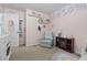 Charming bedroom with a floral accent wall and plush chair at 313 Palladium Dr., Surfside Beach, SC 29575