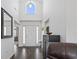 Bright foyer with a high ceiling, hardwood floors, and a front door with sidelights at 313 Palladium Dr., Surfside Beach, SC 29575