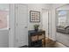 Hallway with wood floors, decorative table, art, and doorways to other rooms at 313 Palladium Dr., Surfside Beach, SC 29575