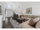 Bright living room featuring a large sectional sofa, wood floors, and arched entryway at 313 Palladium Dr., Surfside Beach, SC 29575