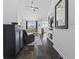 View of open-concept living room with a fireplace, built-in shelves, and hardwood floors at 313 Palladium Dr., Surfside Beach, SC 29575