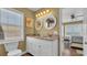 Bright bathroom featuring dual sinks, granite countertops, and a coastal-themed design at 324 S Waccamaw Dr., Garden City Beach, SC 29576