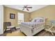 Bright bedroom with a ceiling fan, a window that allows natural light and calming decor at 324 S Waccamaw Dr., Garden City Beach, SC 29576