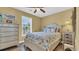 Bright bedroom with coastal decor, a ceiling fan, and natural light at 324 S Waccamaw Dr., Garden City Beach, SC 29576