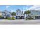 Stunning raised beach house with charming curb appeal and coastal charm near the beach at 324 S Waccamaw Dr., Garden City Beach, SC 29576