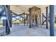 Spacious ground-level area featuring support beams, stairs, and ample space for various uses at 324 S Waccamaw Dr., Garden City Beach, SC 29576