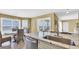 Bright kitchen with granite countertops and a breakfast nook with ocean views at 324 S Waccamaw Dr., Garden City Beach, SC 29576