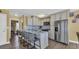 Gorgeous open kitchen with granite countertops, stainless steel appliances, and stylish bar stools at 324 S Waccamaw Dr., Garden City Beach, SC 29576