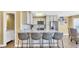 Modern kitchen features granite countertops, stainless steel appliances, and bar seating for four at 324 S Waccamaw Dr., Garden City Beach, SC 29576