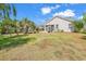 Spacious backyard with a screened porch and mature trees at 3315 Saddlewood Circle, Myrtle Beach, SC 29579