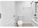 Bright bathroom featuring a toilet, shower-tub combination, and neutral-toned flooring at 3315 Saddlewood Circle, Myrtle Beach, SC 29579