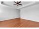 This bright bedroom is enhanced by hardwood flooring and a ceiling fan at 3315 Saddlewood Circle, Myrtle Beach, SC 29579