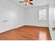 Well-lit bedroom featuring hardwood flooring, a ceiling fan, and a closet at 3315 Saddlewood Circle, Myrtle Beach, SC 29579