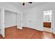 Spacious bedroom featuring hardwood floors, double doors, and an ensuite bathroom at 3315 Saddlewood Circle, Myrtle Beach, SC 29579