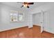 Bedroom with hardwood floors, natural light, ceiling fan, and french doors at 3315 Saddlewood Circle, Myrtle Beach, SC 29579