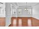 Formal dining room with hardwood floors, wainscoting, and elegant chandelier at 3315 Saddlewood Circle, Myrtle Beach, SC 29579