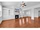 Spacious living room with a fireplace, built-in shelving, and hardwood flooring at 3315 Saddlewood Circle, Myrtle Beach, SC 29579