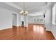 Spacious living area with hardwood floors, fireplace, open to the kitchen and dining areas at 3315 Saddlewood Circle, Myrtle Beach, SC 29579