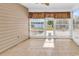 Enclosed sunroom boasts tiled floors and expansive views of the lake at 3315 Saddlewood Circle, Myrtle Beach, SC 29579