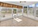 Bright sunroom features tile flooring, large windows with blinds, and neutral tones at 3315 Saddlewood Circle, Myrtle Beach, SC 29579